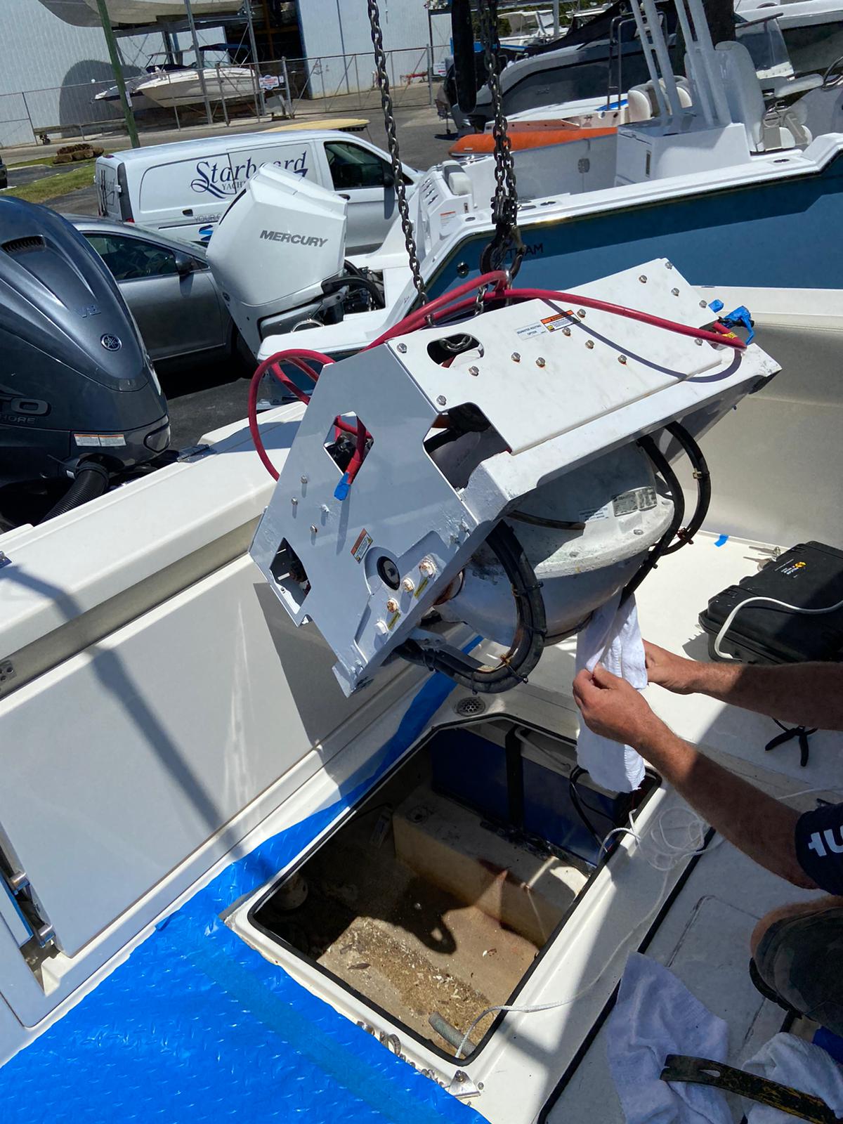 Seakeeper SK2 unit being crane-removed from Cobia 330 DC at Starboard Yacht Group, April 2022